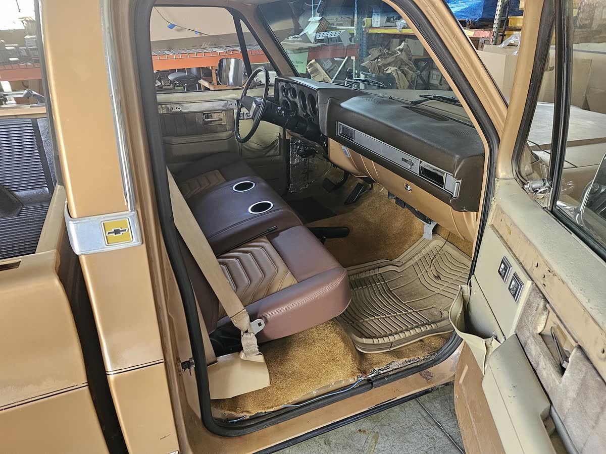 Squarebody passenger-side interior and dash trim in the shop